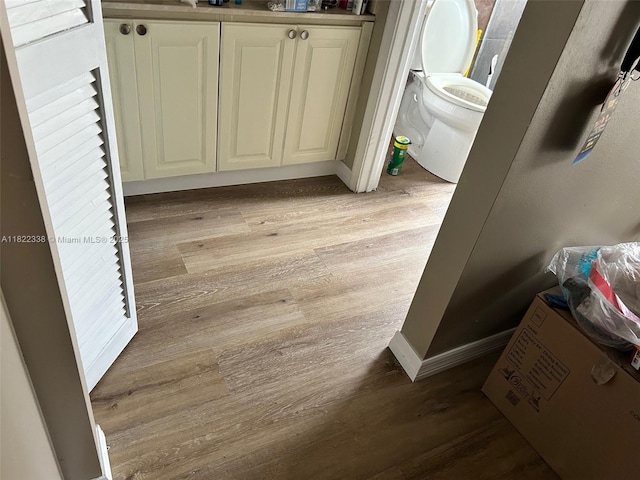 12666 NW 14th Pl Unit 12666, Sunrise, FL 33323 - bathroom featuring toilet and wood finished floors