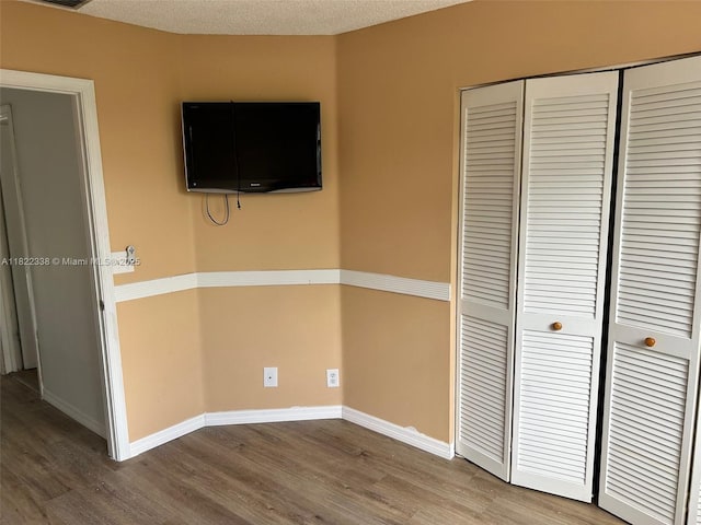 12666 NW 14th Pl Unit 12666, Sunrise, FL 33323 - unfurnished bedroom with wood finished floors and a closet