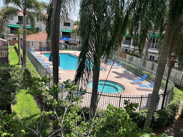 12666 NW 14th Pl Unit 12666, Sunrise, FL 33323 - community pool with a community hot tub and a patio
