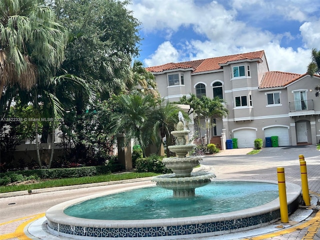 12666 NW 14th Pl Unit 12666, Sunrise, FL 33323 - view of front facade featuring a tile roof and stucco siding