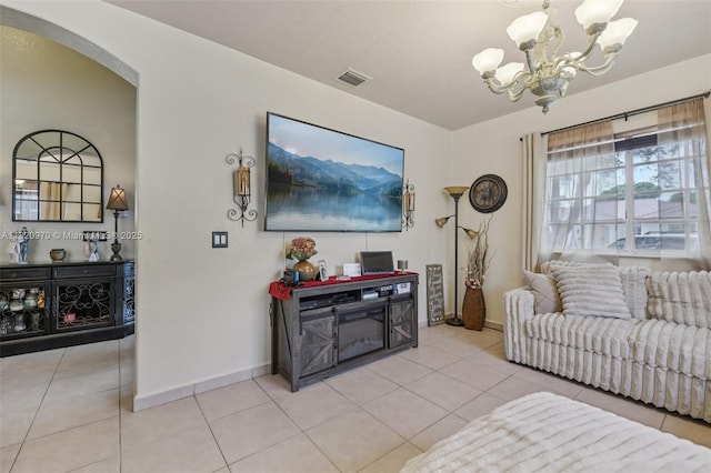 8981 NW 166th Ter, Miami Lakes, FL 33018 - living room featuring a chandelier, light tile patterned floors, and arched walkways