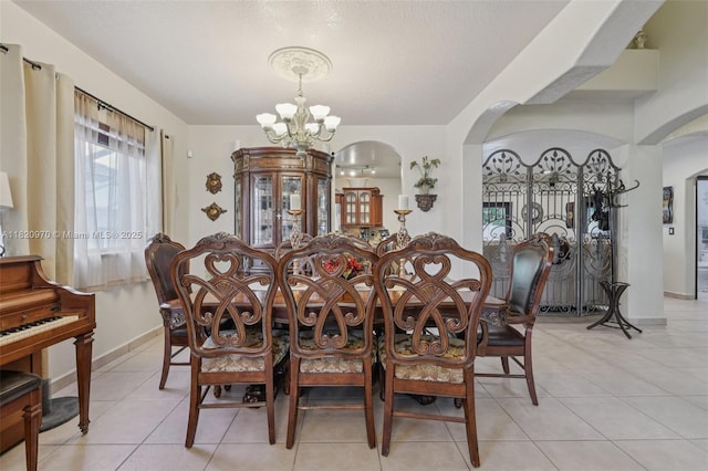 8981 NW 166th Ter, Miami Lakes, FL 33018 - dining room featuring arched walkways, a chandelier, and light tile patterned floors