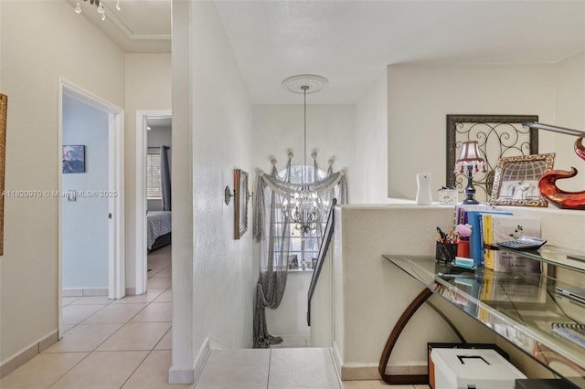 8981 NW 166th Ter, Miami Lakes, FL 33018 - hallway featuring a chandelier and tile patterned floors