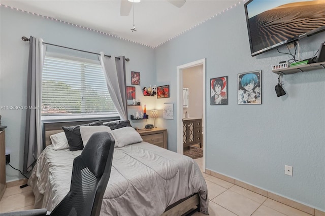 8981 NW 166th Ter, Miami Lakes, FL 33018 - bedroom with light tile patterned floors, ensuite bathroom, and ceiling fan