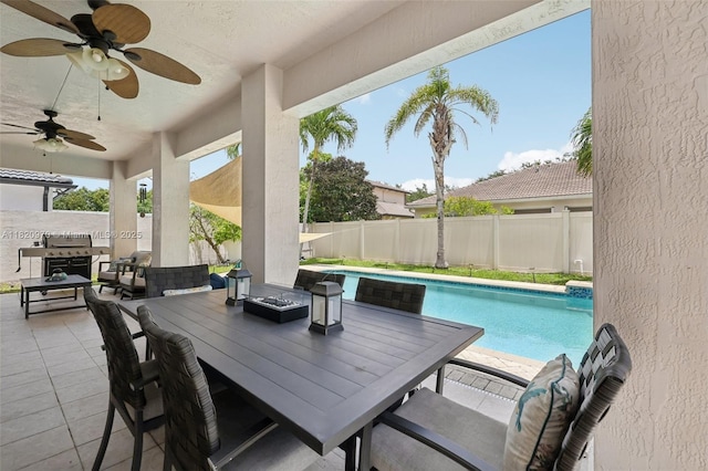 8981 NW 166th Ter, Miami Lakes, FL 33018 - fenced backyard featuring outdoor dining area, a patio area, and a ceiling fan