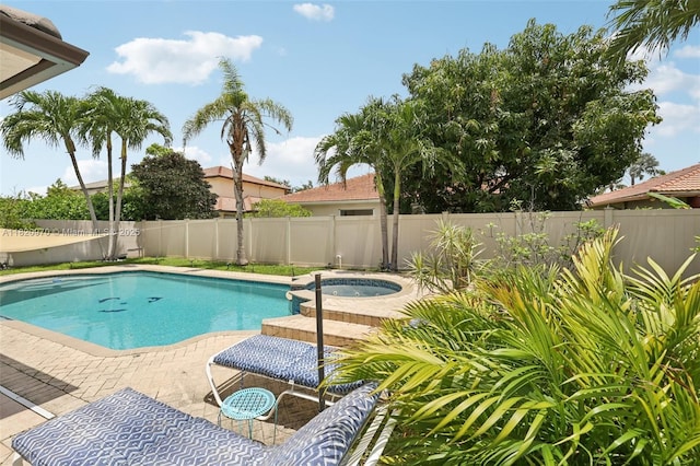 8981 NW 166th Ter, Miami Lakes, FL 33018 - view of swimming pool with a fenced backyard and a pool with connected hot tub