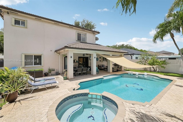 8981 NW 166th Ter, Miami Lakes, FL 33018 - view of pool featuring a patio, a pool with connected hot tub, and outdoor dining space