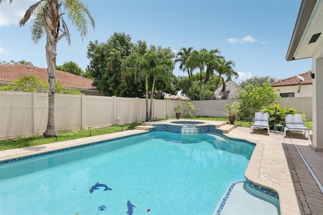 8981 NW 166th Ter, Miami Lakes, FL 33018 - view of pool featuring a fenced backyard and a pool with connected hot tub