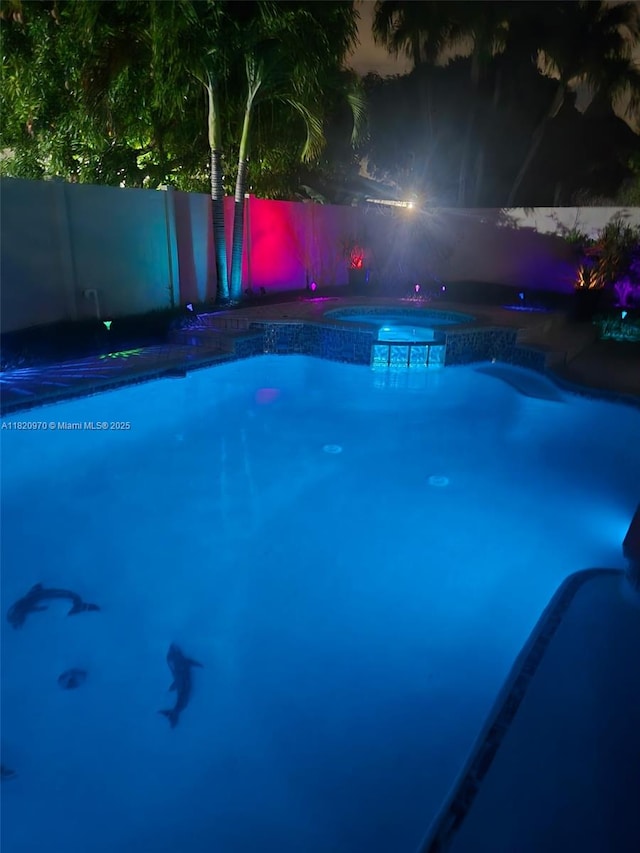 8981 NW 166th Ter, Miami Lakes, FL 33018 - view of swimming pool featuring a pool with connected hot tub