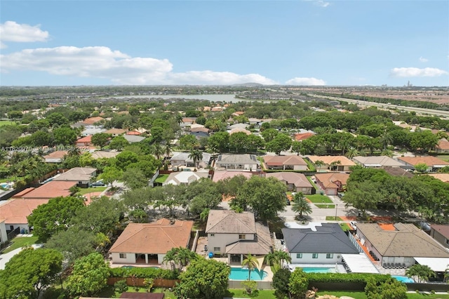8981 NW 166th Ter, Miami Lakes, FL 33018 - aerial perspective of suburban area with a pool area and a large body of water