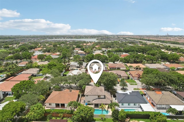 8981 NW 166th Ter, Miami Lakes, FL 33018 - aerial perspective of suburban area featuring a pool area and a nearby body of water