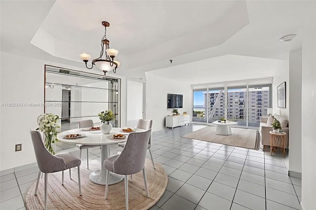 9341 Collins Ave Unit 705, Surfside, FL 33154 - tiled dining space with a chandelier