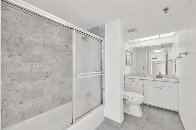 9341 Collins Ave Unit 705, Surfside, FL 33154 - bathroom with vanity, bath / shower combo with glass door, and marble finish flooring