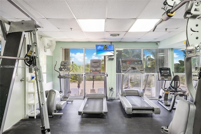 9341 Collins Ave Unit 705, Surfside, FL 33154 - gym featuring a paneled ceiling