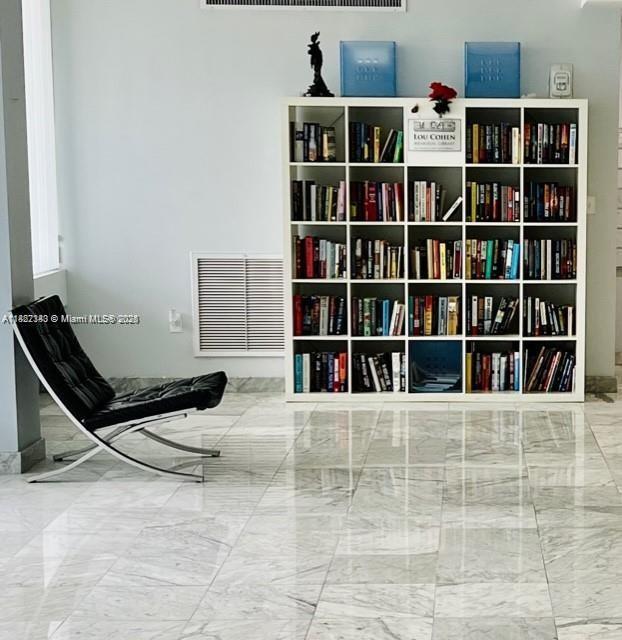 9341 Collins Ave Unit 705, Surfside, FL 33154 - sitting room with marble look tile flooring