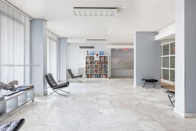 9341 Collins Ave Unit 705, Surfside, FL 33154 - living area with a textured ceiling and marble finish floors