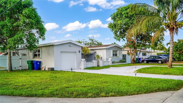 7795 Granada Blvd, Miramar, FL 33023 - ranch-style home with stucco siding, driveway, an attached garage, a fenced front yard, and a gate