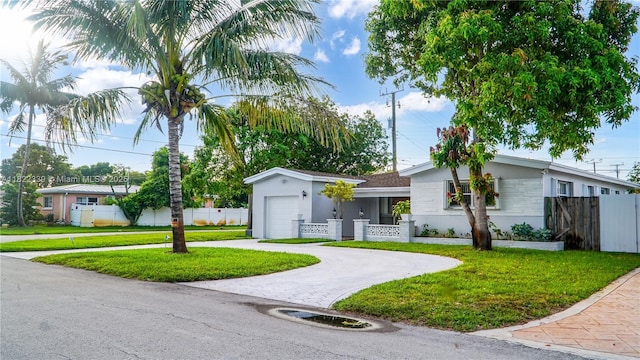 7795 Granada Blvd, Miramar, FL 33023 - single story home with stucco siding, an attached garage, and decorative driveway