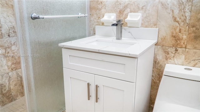 7795 Granada Blvd, Miramar, FL 33023 - bathroom with a stall shower, tile walls, and vanity