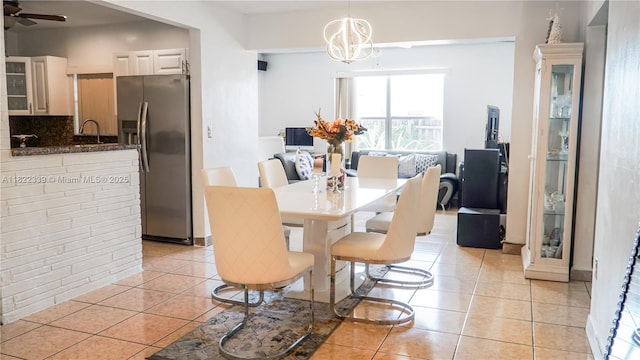 7795 Granada Blvd, Miramar, FL 33023 - dining room with light tile patterned flooring, ceiling fan, and a chandelier