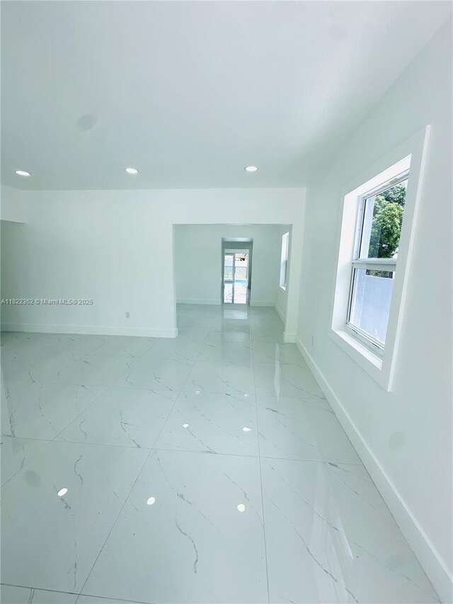 82 E 16th St, Hialeah, FL 33010 - spare room featuring light marble finish flooring and recessed lighting