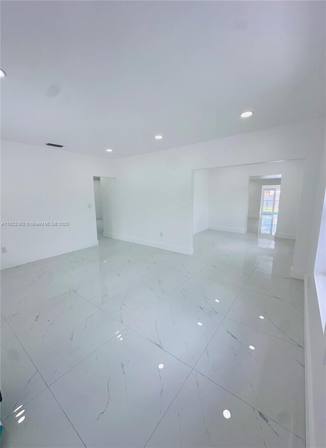 82 E 16th St, Hialeah, FL 33010 - empty room with recessed lighting and light marble finish flooring