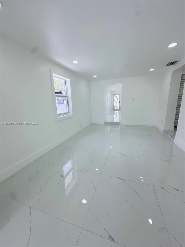 82 E 16th St, Hialeah, FL 33010 - spare room featuring recessed lighting and light marble finish flooring