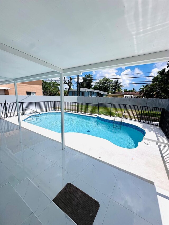 82 E 16th St, Hialeah, FL 33010 - view of swimming pool featuring a patio