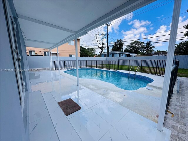 82 E 16th St, Hialeah, FL 33010 - view of pool with a patio area and a fenced backyard