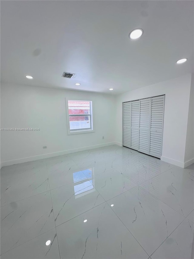 82 E 16th St, Hialeah, FL 33010 - empty room featuring light marble finish floors and recessed lighting