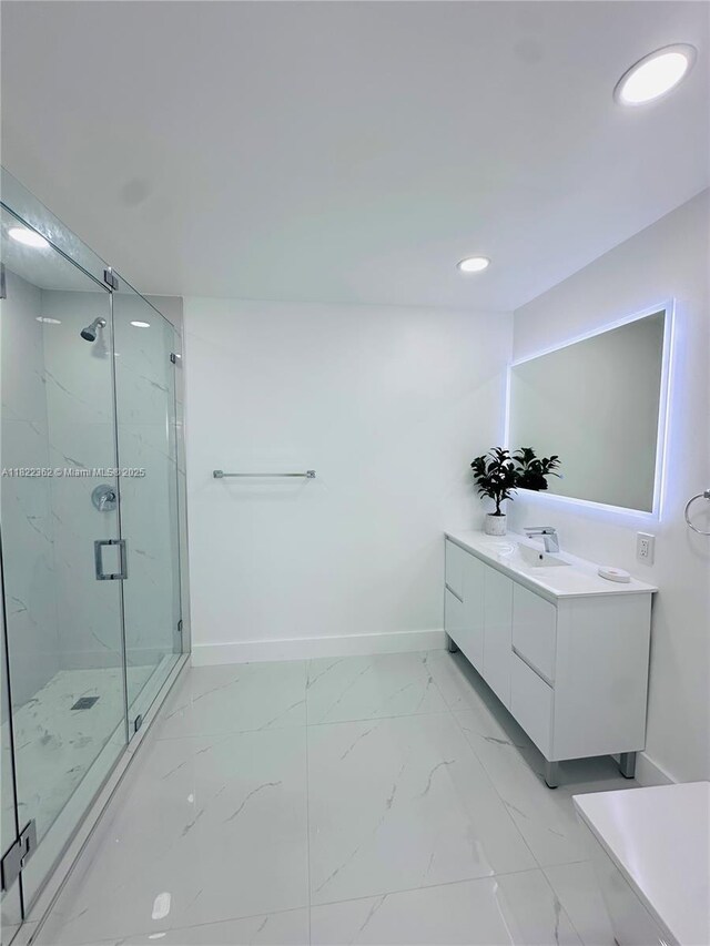 82 E 16th St, Hialeah, FL 33010 - full bath featuring a marble finish shower, vanity, recessed lighting, and marble look tile flooring
