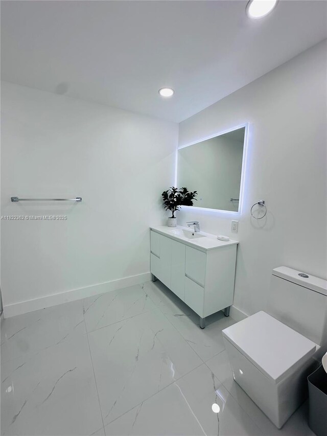 82 E 16th St, Hialeah, FL 33010 - bathroom with vanity, marble finish floors, and recessed lighting