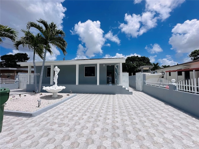 82 E 16th St, Hialeah, FL 33010 - back of house featuring a gate
