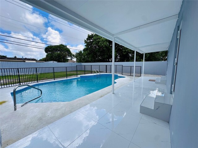 82 E 16th St, Hialeah, FL 33010 - view of pool with a patio area and a fenced backyard