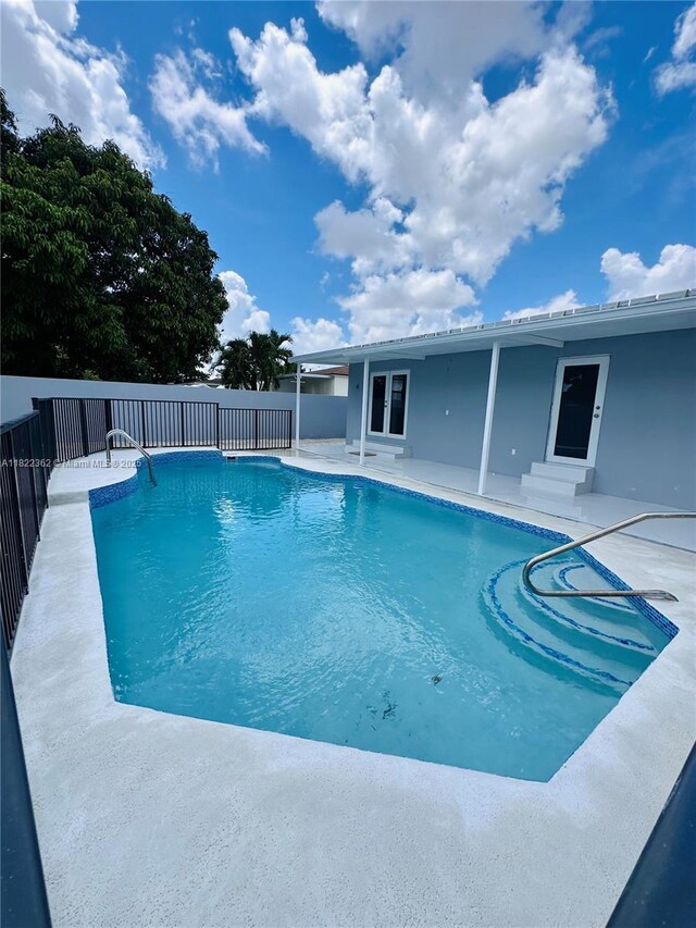 82 E 16th St, Hialeah, FL 33010 - view of swimming pool featuring a patio
