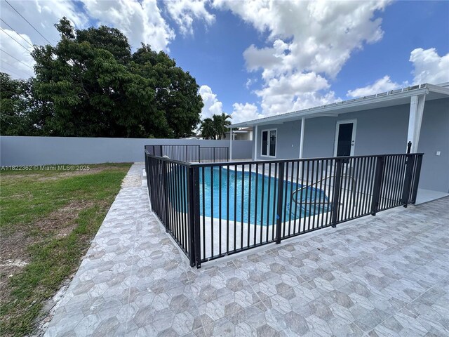 82 E 16th St, Hialeah, FL 33010 - view of swimming pool featuring a patio area