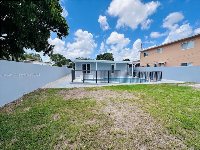 82 E 16th St, Hialeah, FL 33010 - back of house with a fenced backyard, a patio, and stucco siding