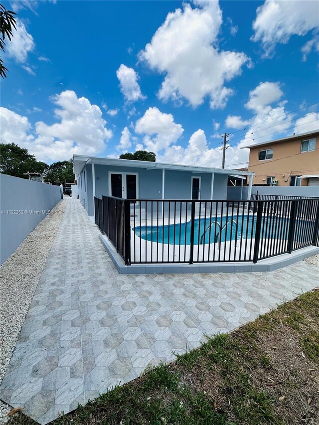 82 E 16th St, Hialeah, FL 33010 - view of swimming pool featuring a patio area