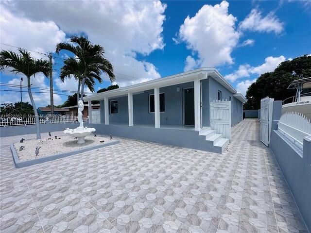 82 E 16th St, Hialeah, FL 33010 - back of house with a porch and stucco siding