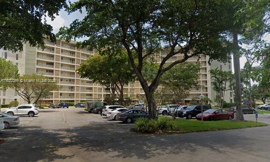 3090 N Course Dr Unit 807, Pompano Beach, FL 33069 - view of apartment building / complex featuring uncovered parking