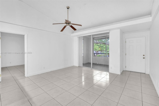 811 Lyons Rd Unit 20203, Coconut Creek, FL 33063 - spare room with a ceiling fan, light tile patterned flooring, and vaulted ceiling