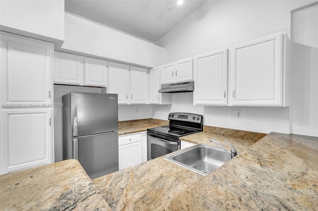 811 Lyons Rd Unit 20203, Coconut Creek, FL 33063 - kitchen featuring appliances with stainless steel finishes, under cabinet range hood, white cabinets, lofted ceiling, and a textured ceiling