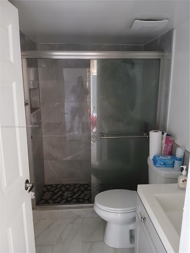 2055 SW 122nd Ave Unit 113, Miami, FL 33175 - bathroom featuring vanity, marble finish flooring, and a stall shower