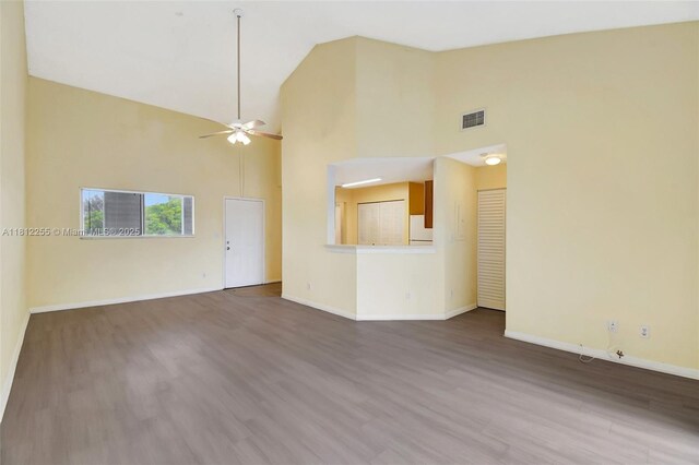 3401 NW 44th St Unit 201, Oakland Park, FL 33309 - unfurnished living room with ceiling fan, dark wood-style flooring, and high vaulted ceiling