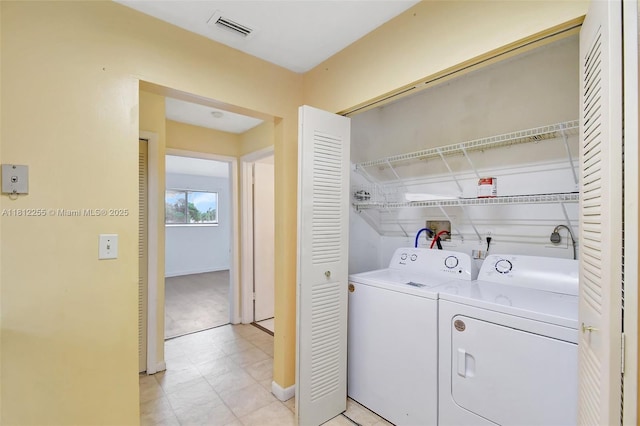 3401 NW 44th St Unit 201, Oakland Park, FL 33309 - laundry area featuring washer and clothes dryer and baseboards