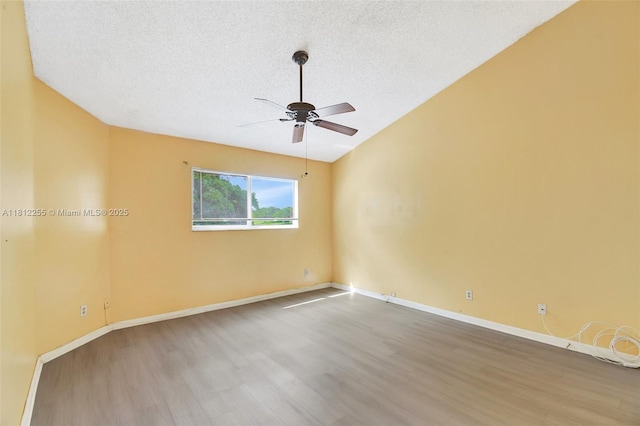 3401 NW 44th St Unit 201, Oakland Park, FL 33309 - spare room featuring wood finished floors, a ceiling fan, and a textured ceiling