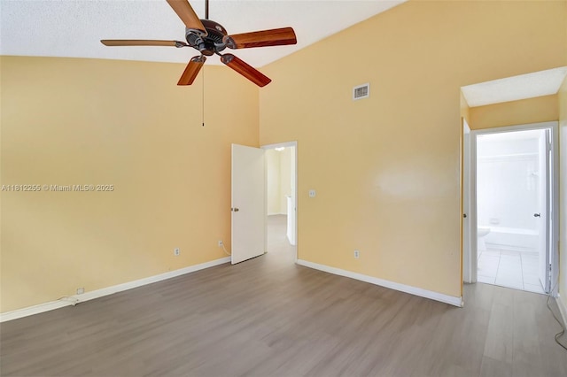 3401 NW 44th St Unit 201, Oakland Park, FL 33309 - spare room with wood finished floors, a ceiling fan, and high vaulted ceiling