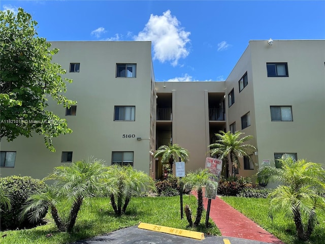 5160 Las Verdes Cir Unit 103, Delray Beach, FL 33484 - view of apartment building / complex with uncovered parking