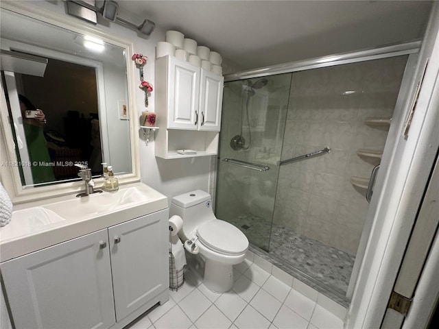 5160 Las Verdes Cir Unit 103, Delray Beach, FL 33484 - bathroom featuring tile patterned flooring, a stall shower, and vanity