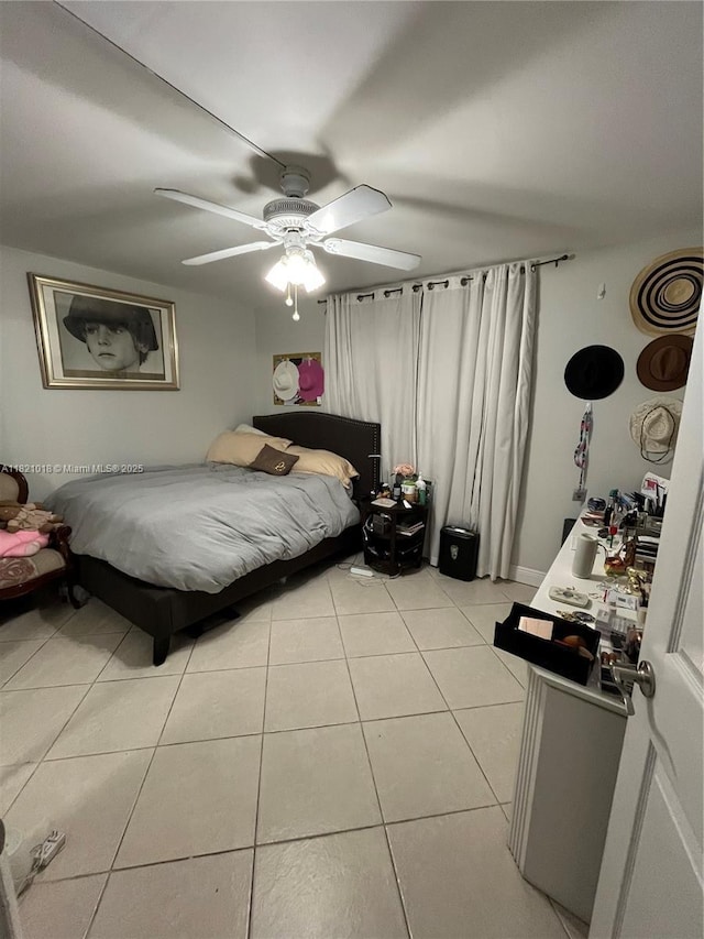 5160 Las Verdes Cir Unit 103, Delray Beach, FL 33484 - bedroom featuring light tile patterned floors and ceiling fan